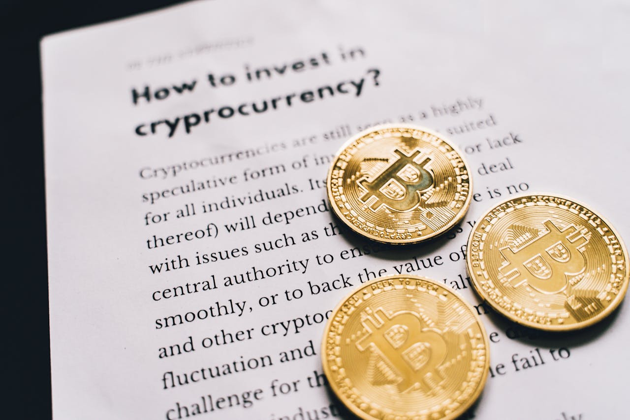 about-07 Close-up of Bitcoin coins on an investment guide paper.